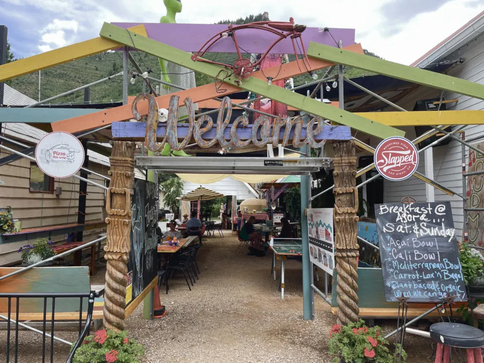 The eclectic entrance of the Agora, a unique restaurant and community gathering place in Minturn.
