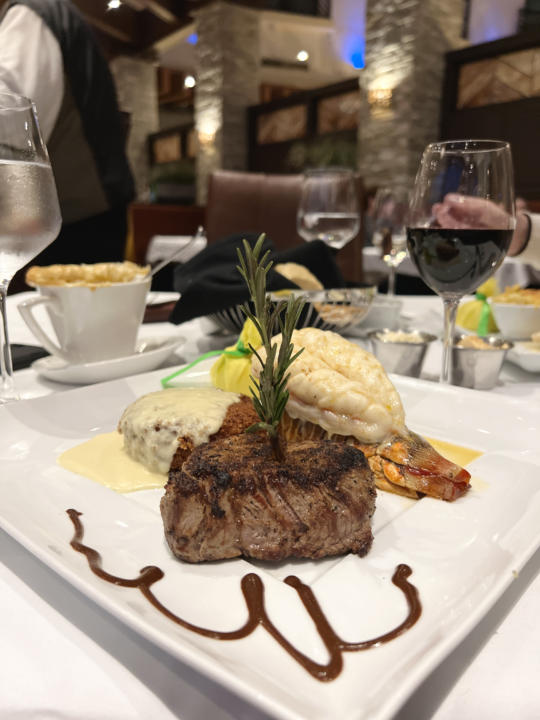 Land & Sea, lobster tail and filet mignon, with wild mushroom risotto cake at Seven Rivers.