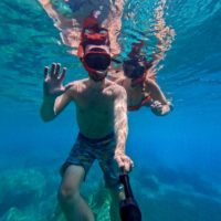 Jake and Emily Snorkeling in St. Lucia which is one of the best things to do in soufriere