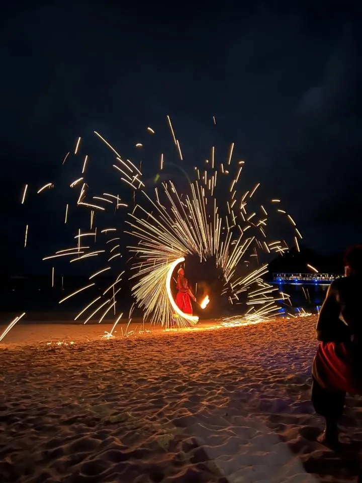 a fire performer at Sandals Grande on Beach Night