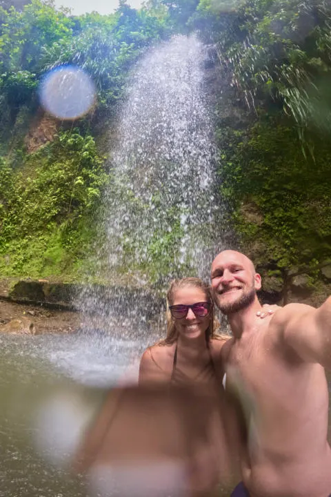 The Two Roaming Souls swimming under Toraille Falls in St. Lucia.