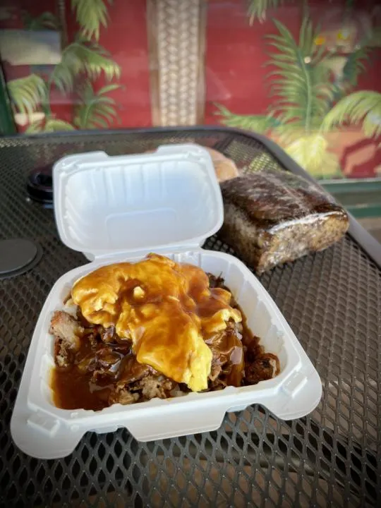 saucey gravy over a loco moco from Gina's one of the best breakfast restaurants in Kauai