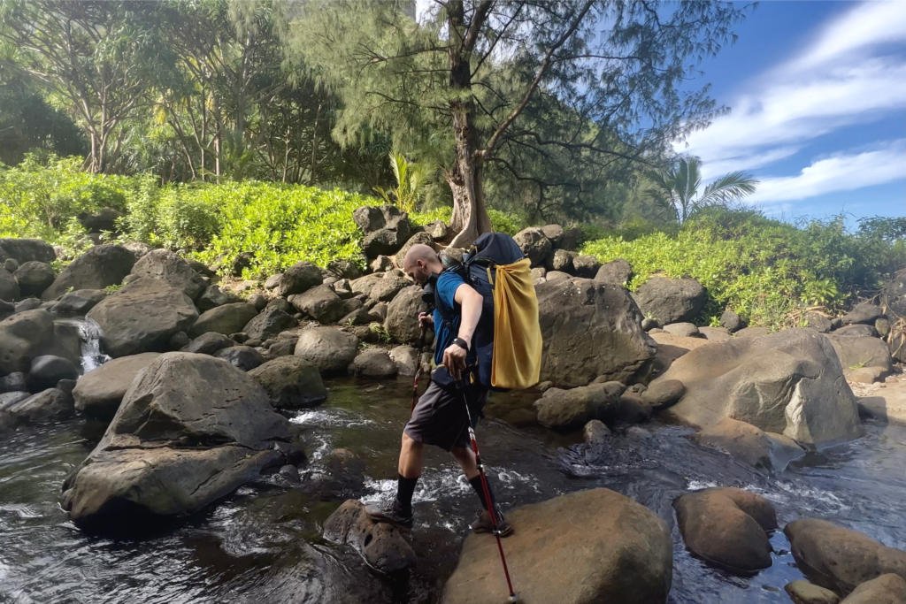 Jake crossing the slippery rocks to get over Hanakapi'ai Stream.
