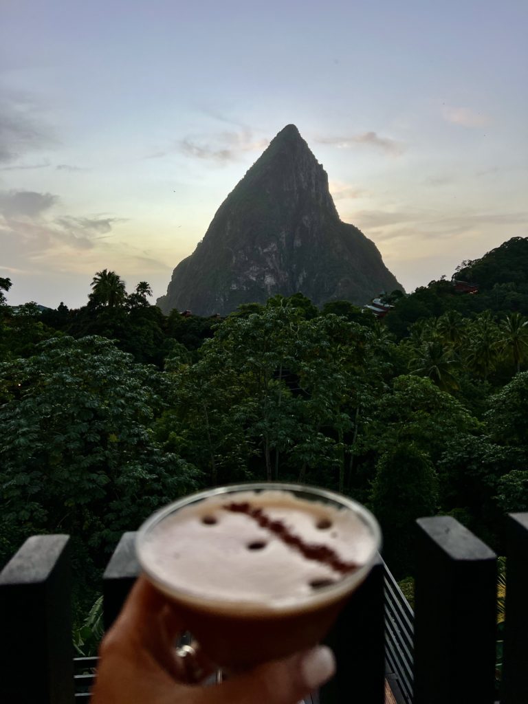The view from Rabot Hotel's on-site restaurant with a hotel chocolat martini which is one of the best hotels in soufriere, St. Lucia