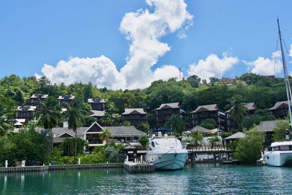a view of Zoetry Resort Marigot Bay which is one of the best resorts in St. Lucia from a boat in the marina