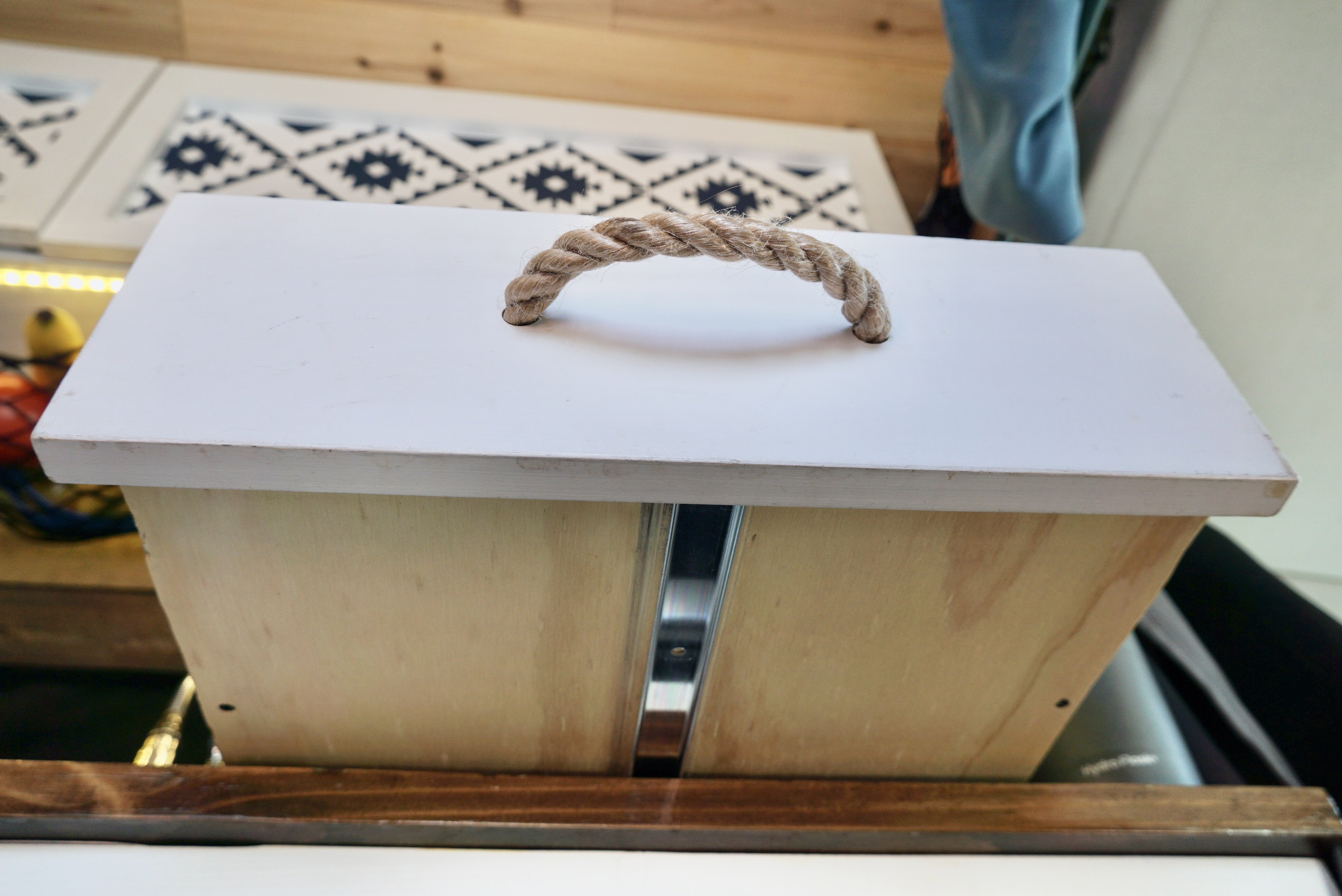 A center mount drawer slide goes down the middle underneath a drawer box.