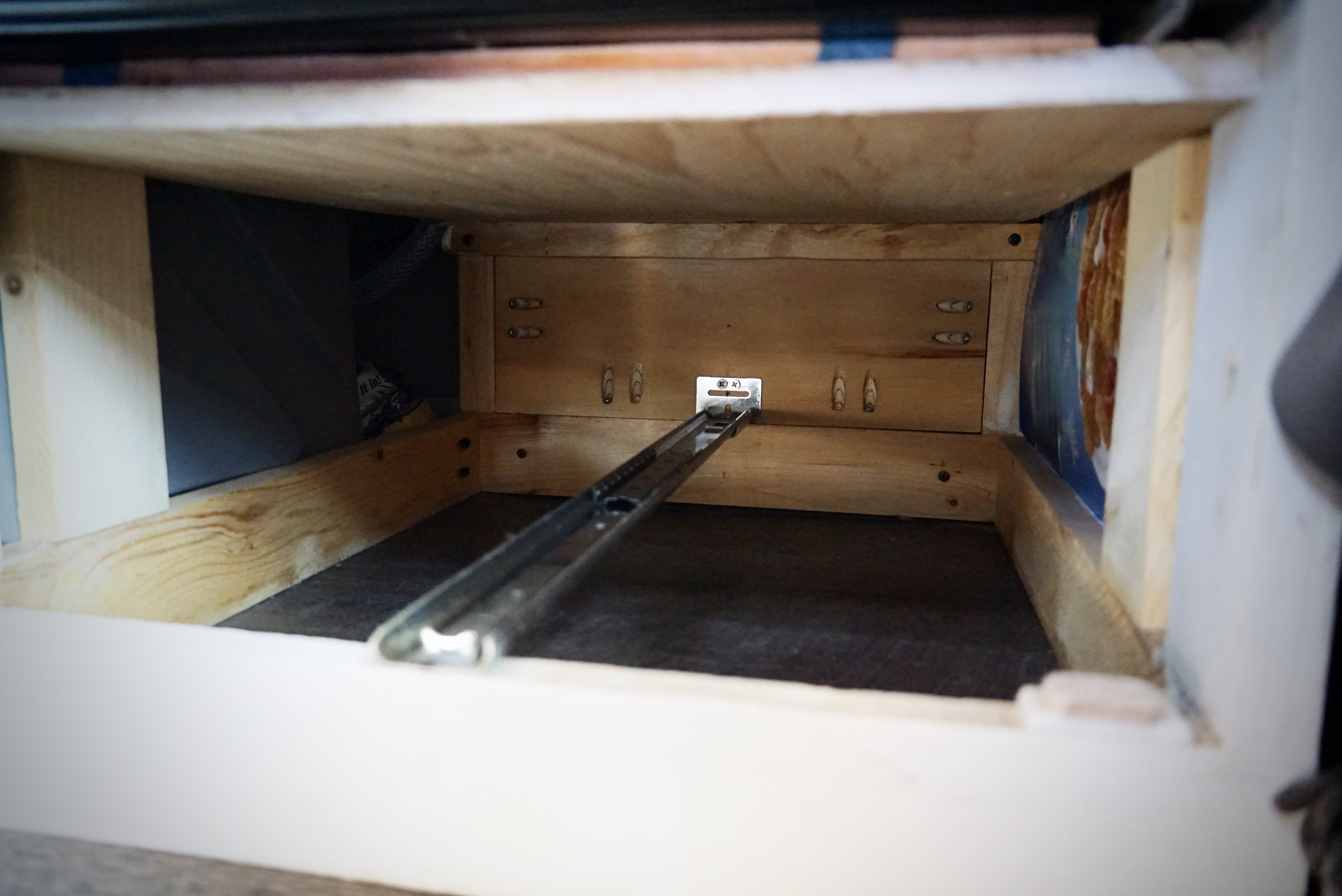 A rear mounted drawer slide attaches to the back of your cabinet.