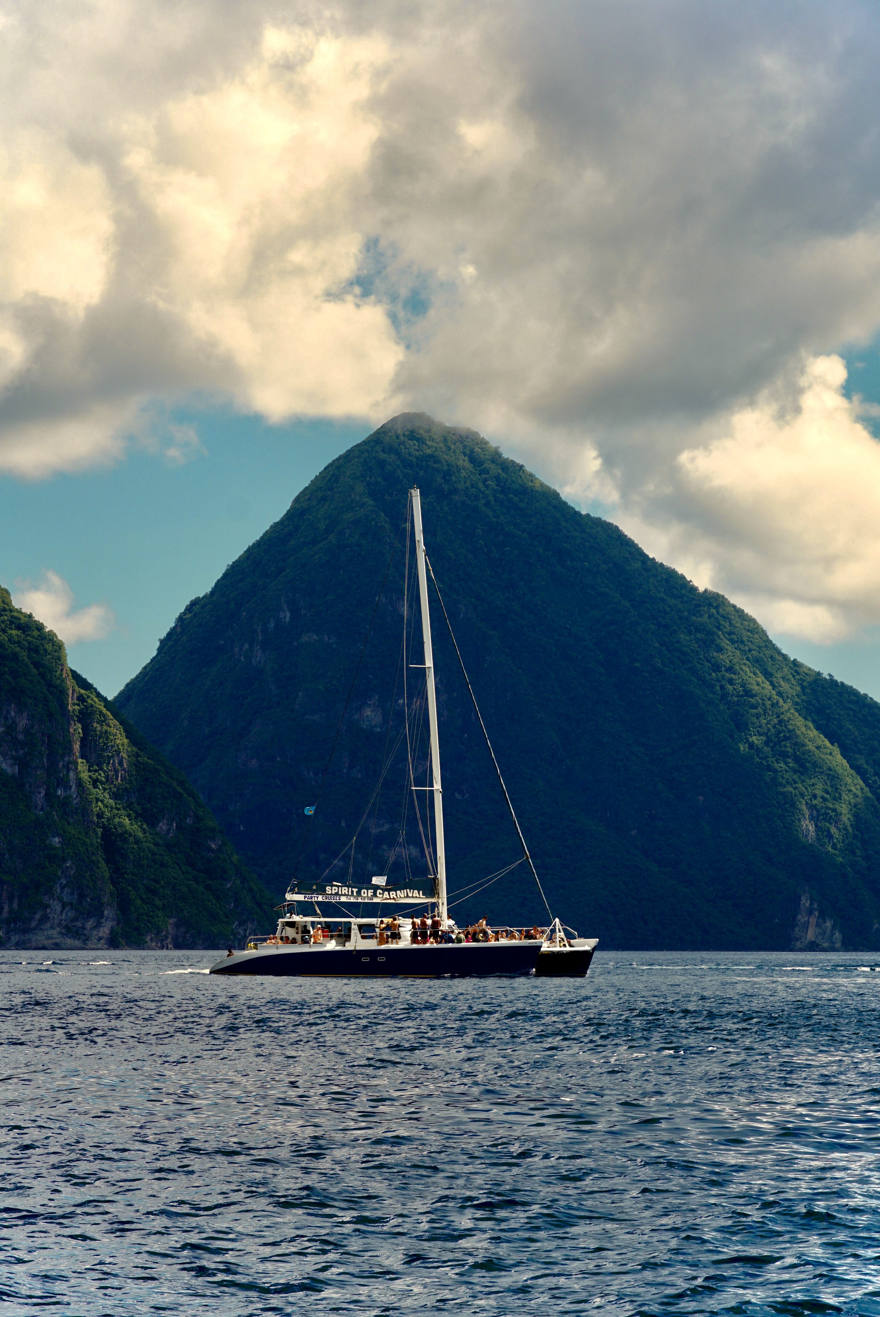 a catamarran full of people in from of Gros Piton, showing one of the best St. Lucia excursions