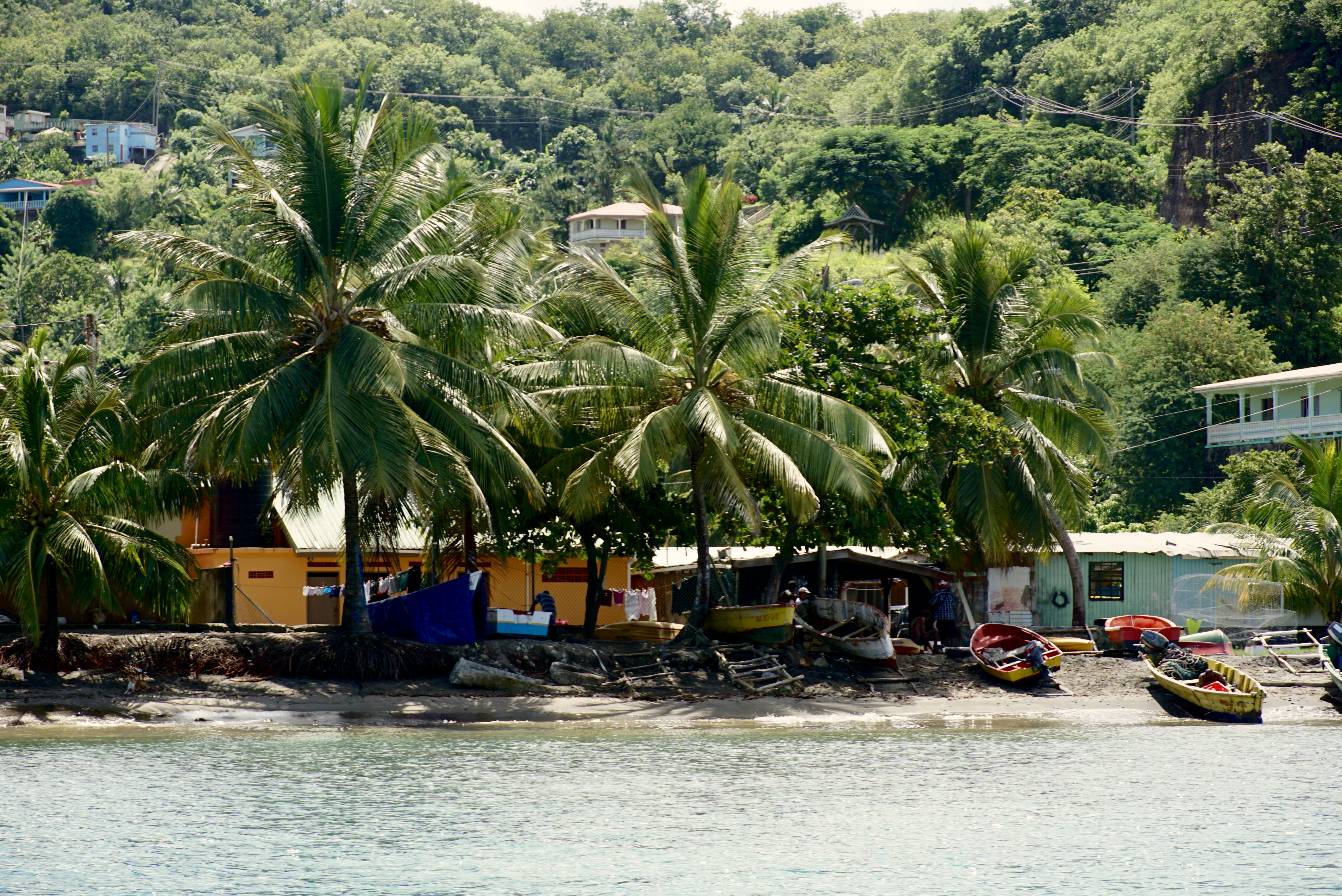 cruising by an old fishing village in St. Lucia, which is best done on a private boat tour in the caribbean