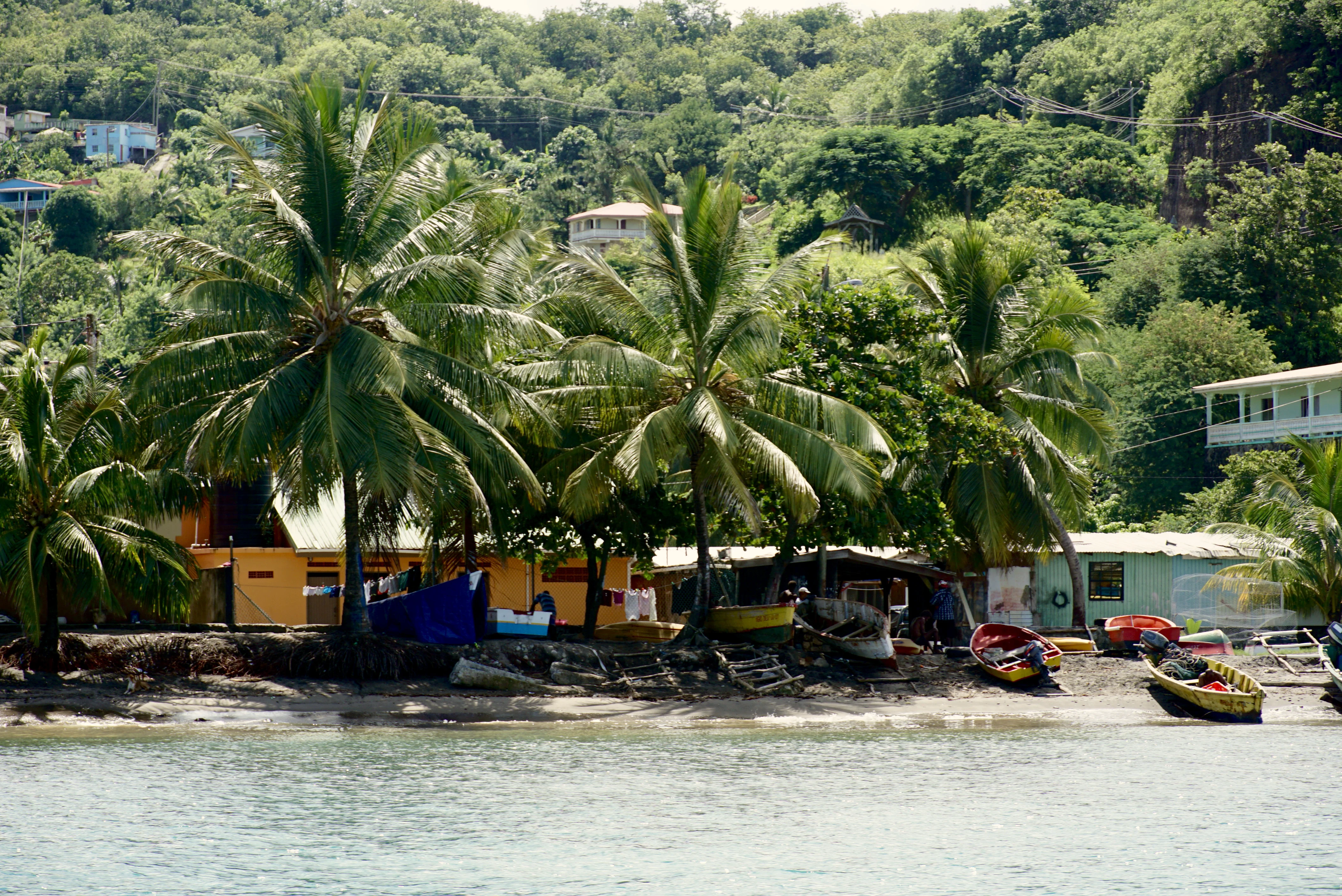 cruising by an old fishing village in St. Lucia, which is best done on a private boat tour in the caribbean