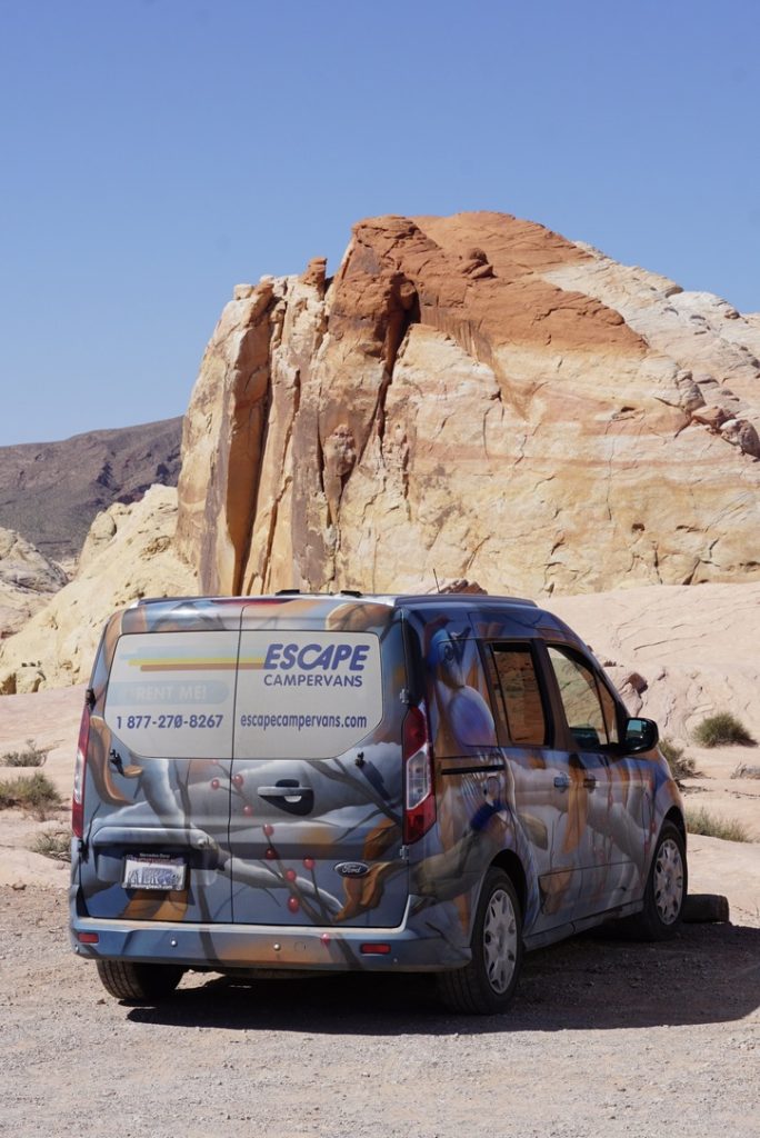 A colorful Ford Transit Connect Rental by Escape Campervans.