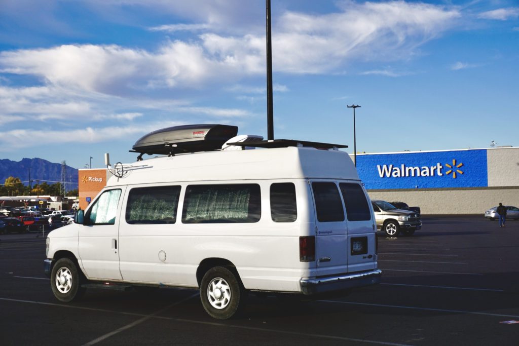 A campervan parked at Walmart, one of the few businesses that sometimes allow overnight camping.