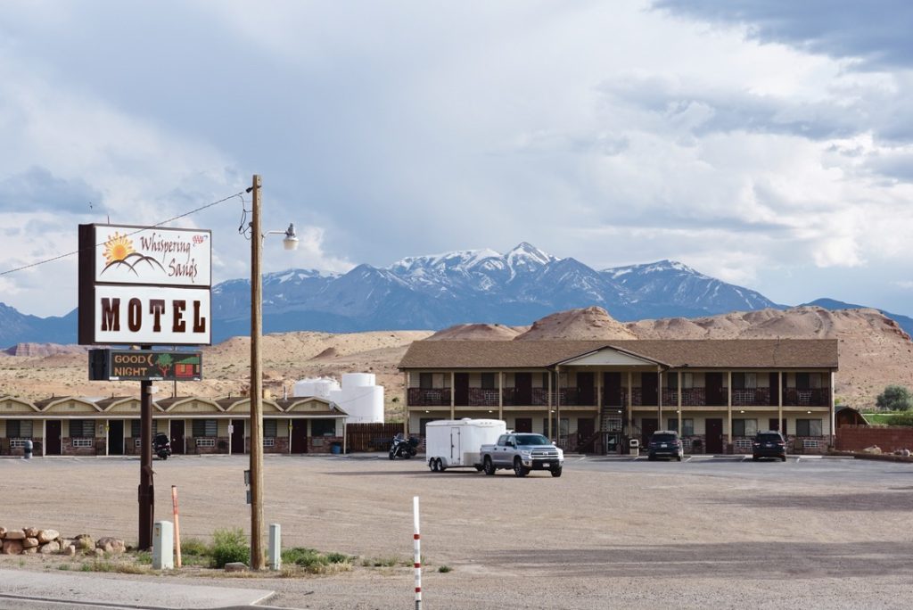 Whispering Sands Motel in Hanksville Utah with the Henry Mountains in the backgrouns