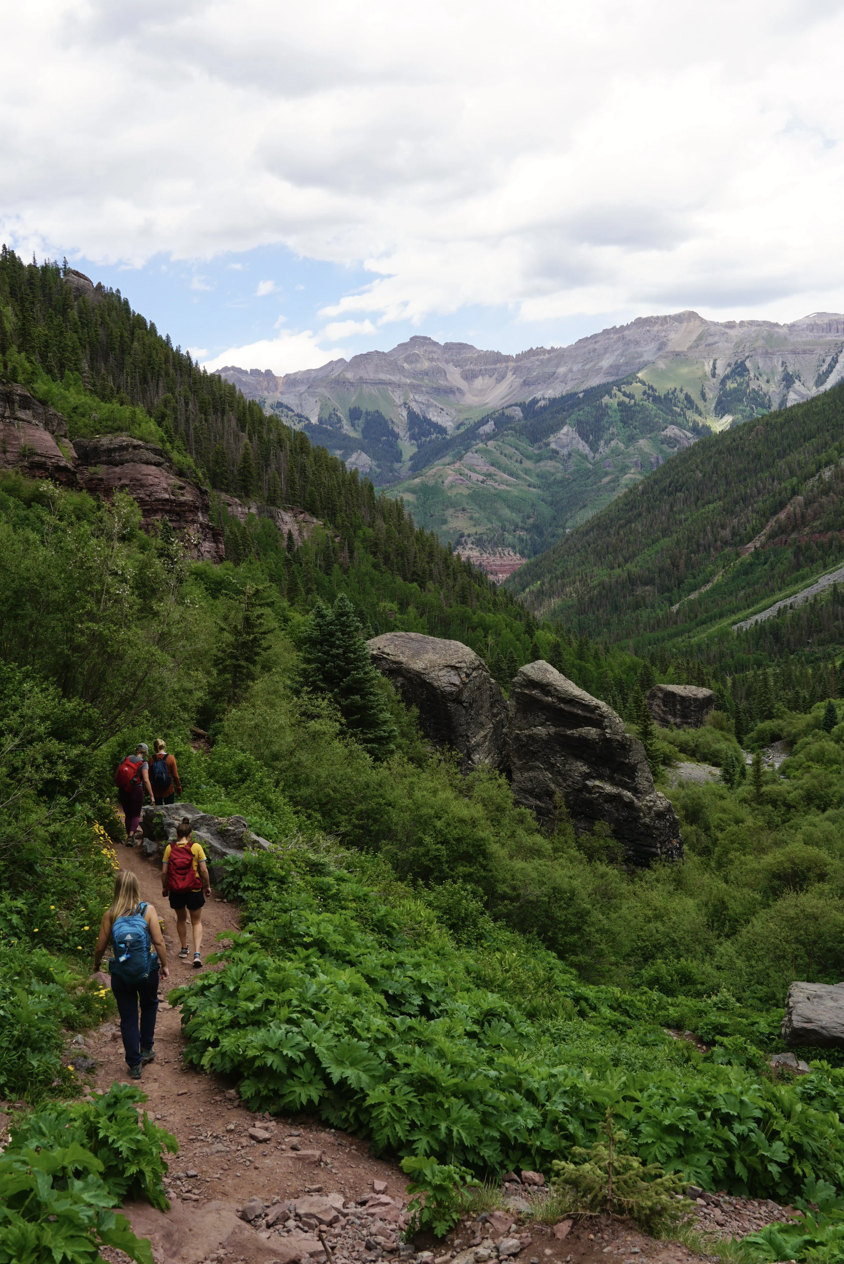 Hikers sharing the trail through the mountains.