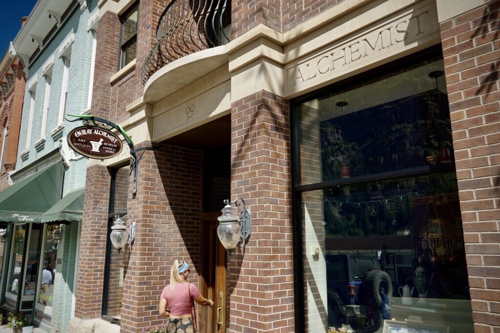 Emily walking into The Alchemist Museum in downtown Ouray