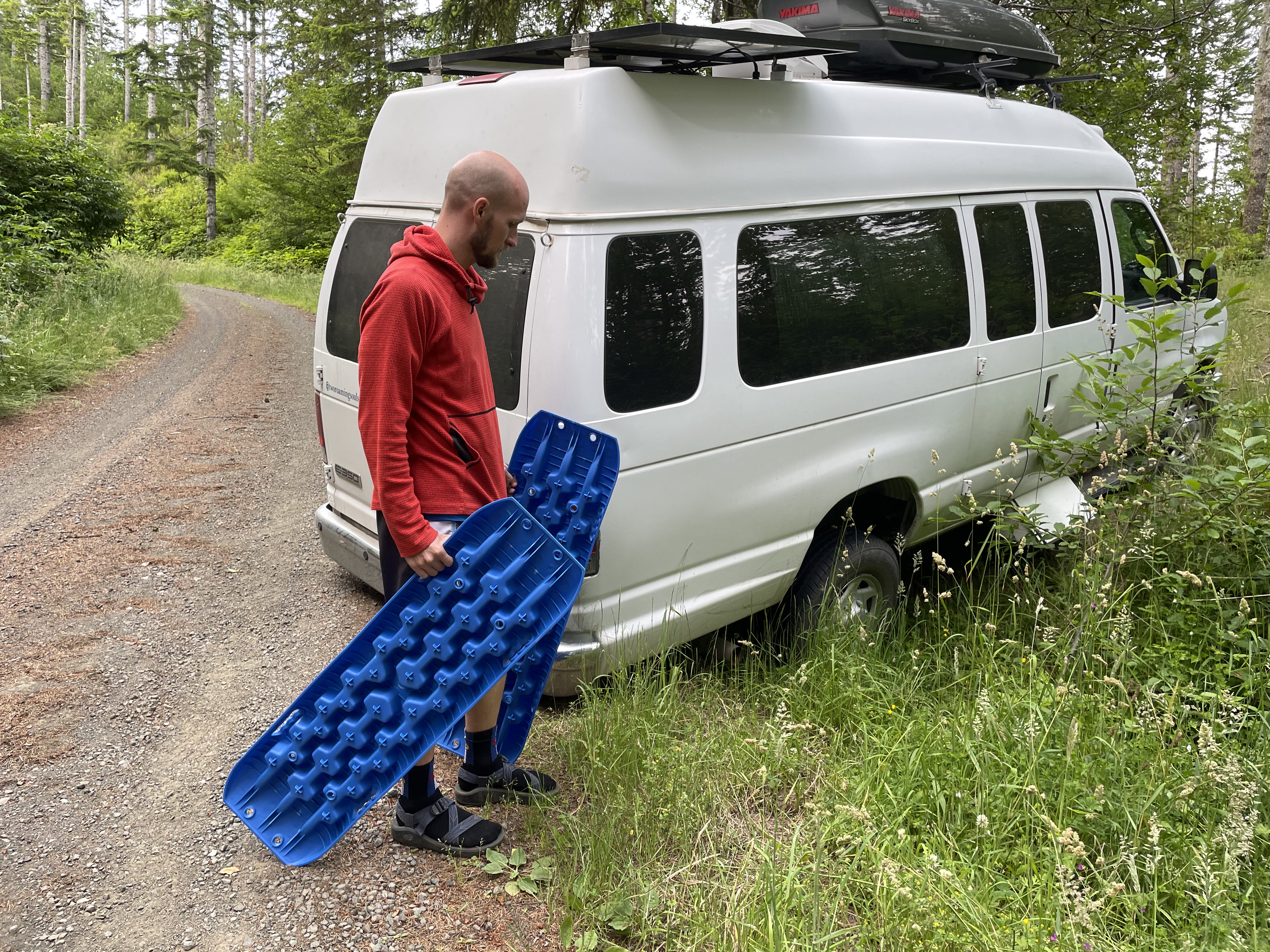 A campervan stuck off-roading is going to be saved with traction boards.