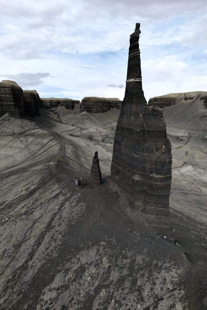 Time lapse tracking shot of Long Dong Silver spire rock over mud