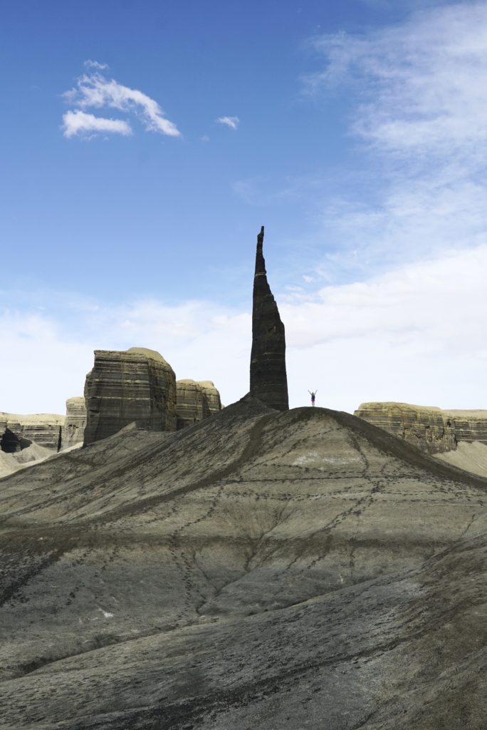 Time lapse tracking shot of Long Dong Silver spire rock over mud