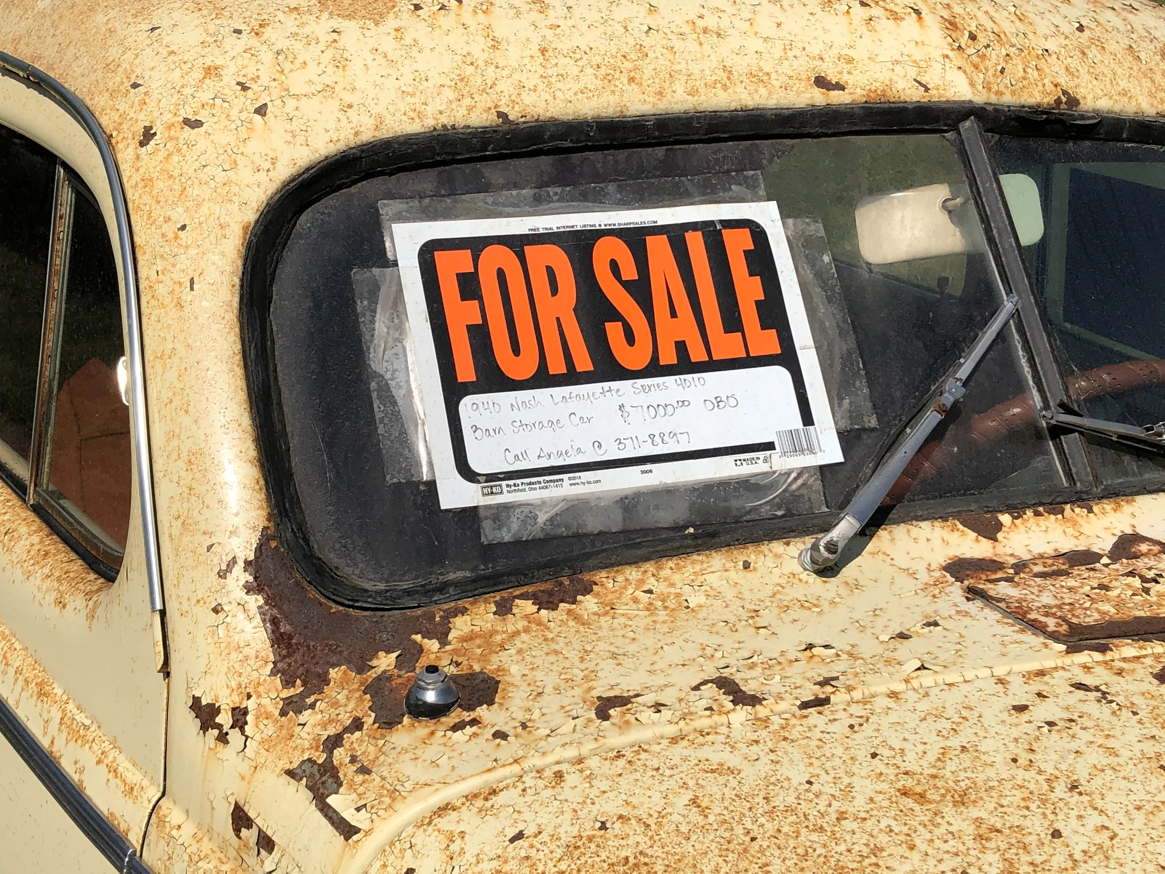 a for sale sign in a car window which can be a great place for where to buy a used van for a campervan conversions