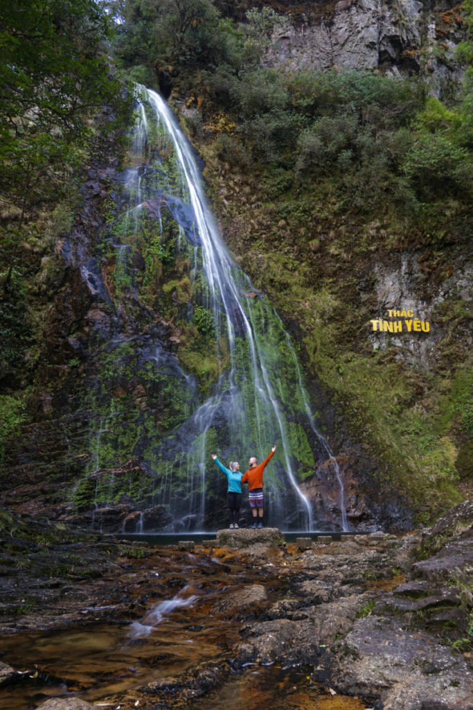 The Two Roaming Souls posing in from of Love Waterfall in Sapa Vietnam