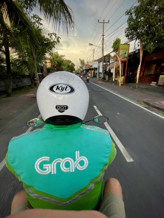 Riding on the back of a Grab Motorbike