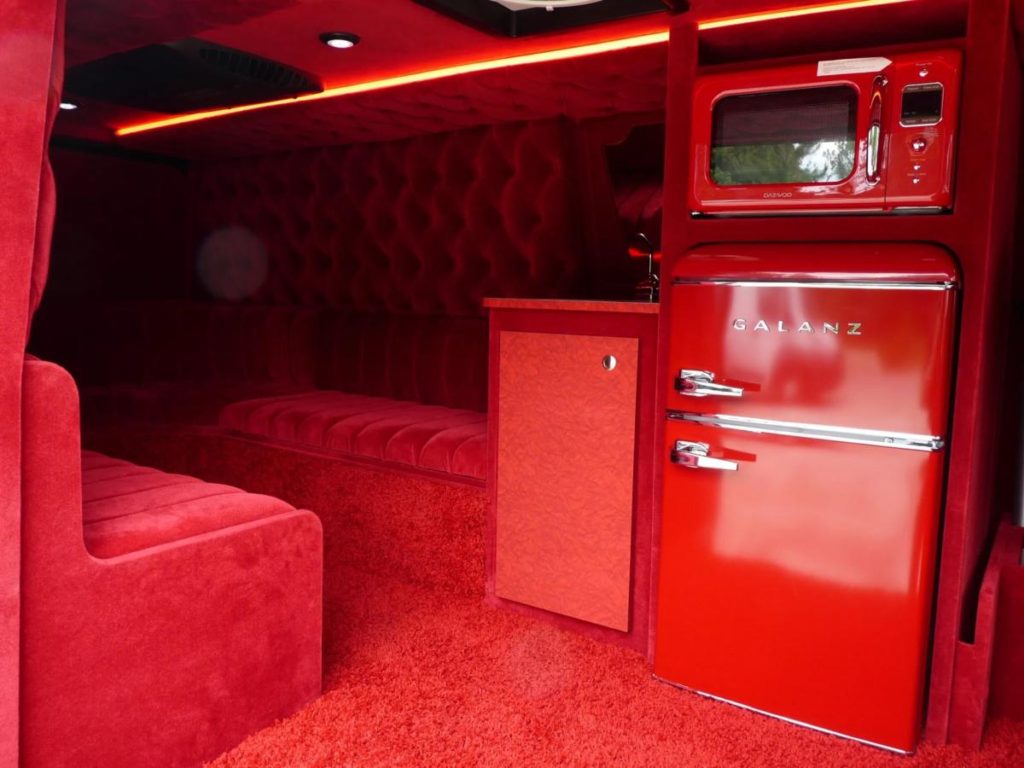 Super Customized red interior on a Ford Econoline Van Conversion by Custom Coach Creations