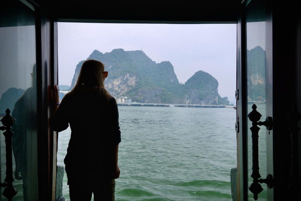 Emily looking out of the doors on a Halong Bay Cruise
