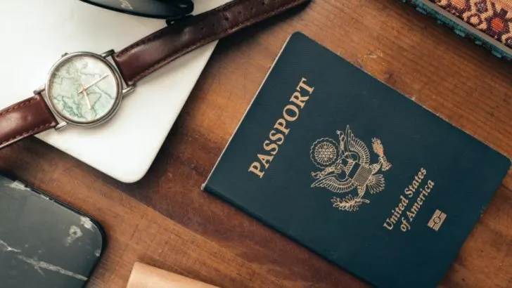 a passport sitting on a desk, which is one of the most important things to know before traveling to Thailand is that there is no visa rrerquired, just a valid passport