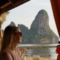 emily staring out at the limestone pillars that make up Tonsai Beach in Thailand