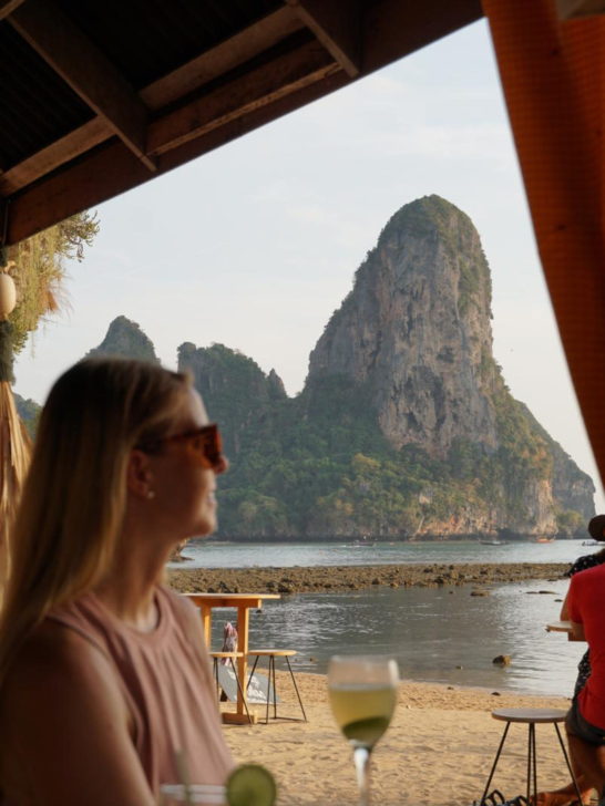 emily staring out at the limestone pillars that make up Tonsai Beach in Thailand