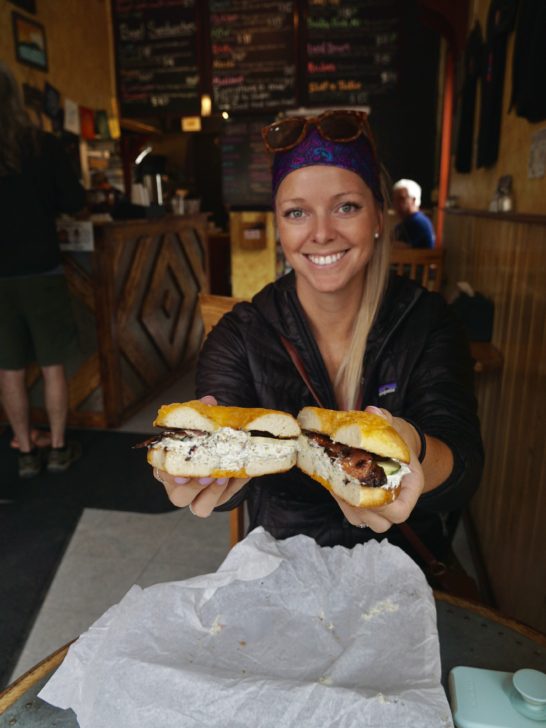 Emily enjoying her Butte Bagel which is one of the best restaurants in Crested Butte, CO