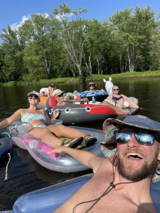 Jake wearing the Mission Cooling Bucket Hat on a river float, which can make a great gift for hikers and backpackers to keep them cool out on the trail