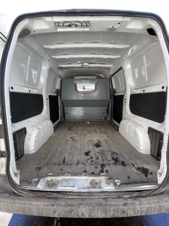 Chevy City Express compact cargo van empty interior