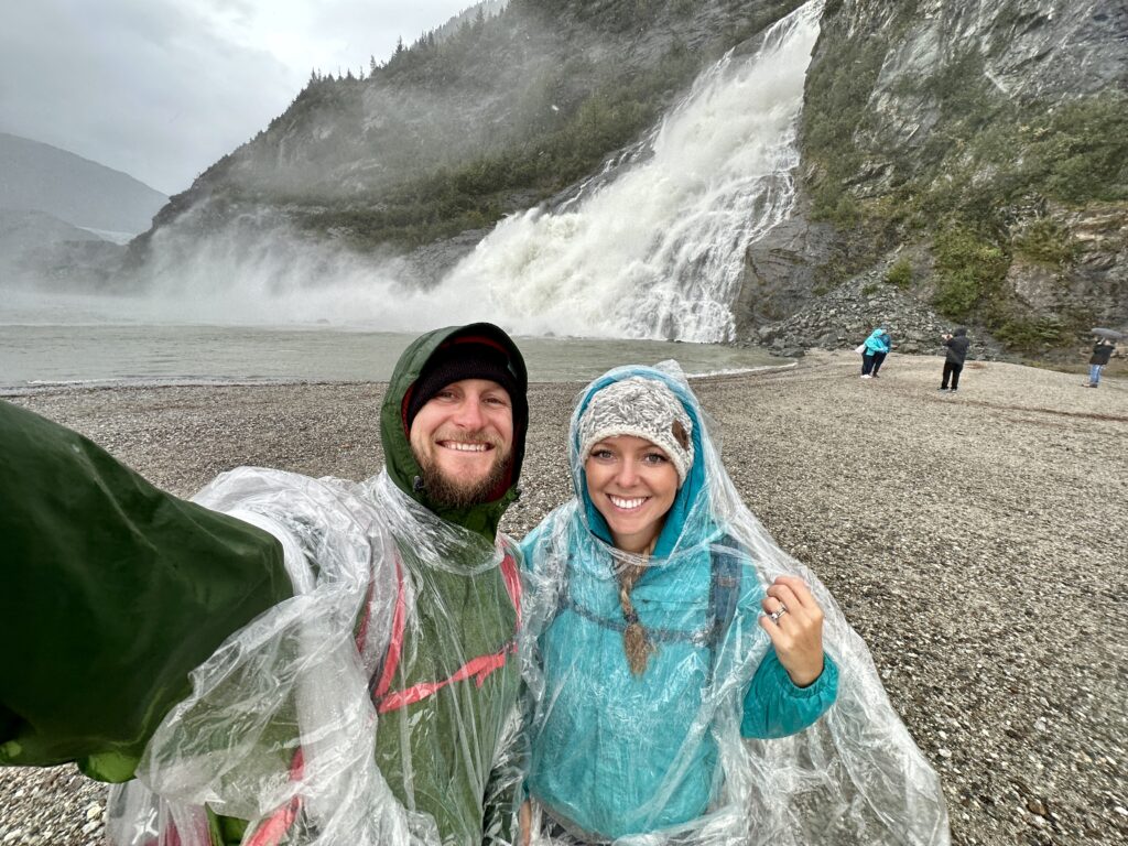 Jake & Emily wearing a poncho on a shore excursion on an Alaskan Cruise
