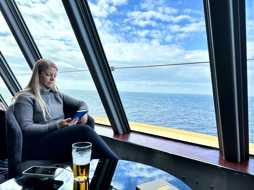 Emily reading her Kindle on an Alaskan Cruise