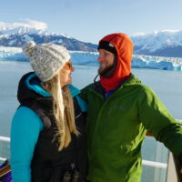 Jake & Emily bundled aboard an Alaskan Cruise, representing what to pack for an Alaska Cruise