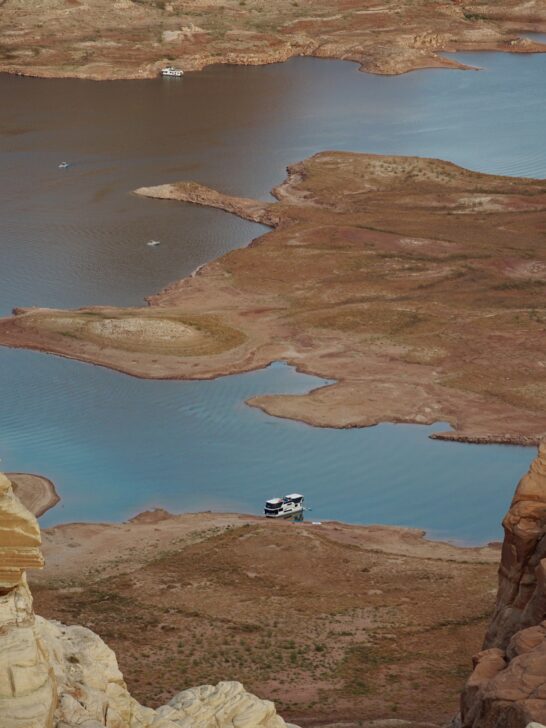 A houseboat anchored in Gunsight Bay Lake Powell.