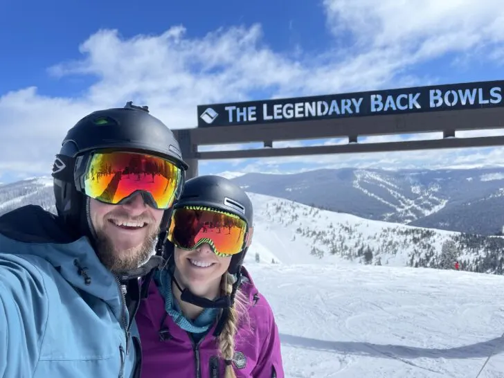 Jake and Emily posing in front of Vail's Legendary Back Bowls Sign