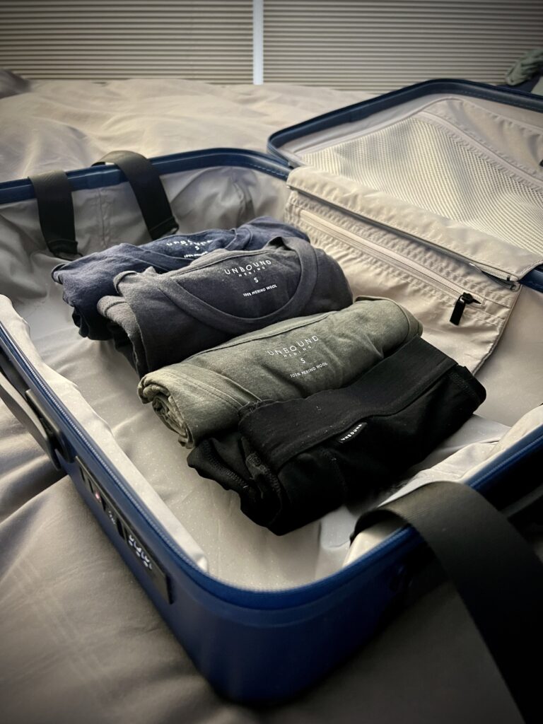 a suitcase full of Unbound Merino Clothing