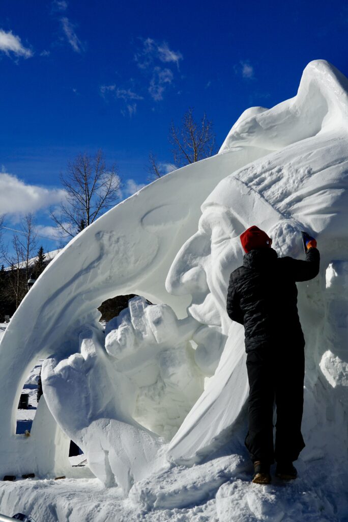 One of the artists working on their ice sculture for the International Snow Sculptures Championships in Breckenridge, CO