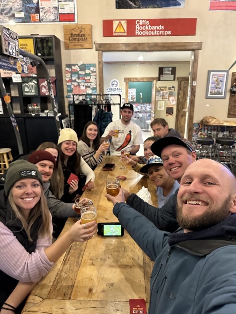 a group enjoying a beer at Broken Compass Brewery in Breckenridge, CO