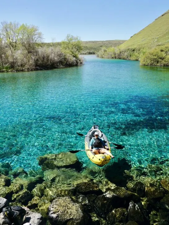 Emily kayaking in the blue water of the springs.