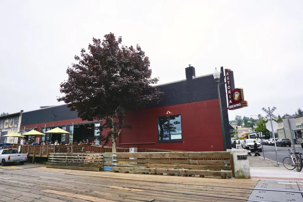 The exterior and oceanfront patio at the Astoria Brewing Company