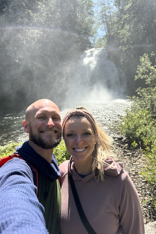 Jake and Emily taking a selfie in front of Young River Falls.