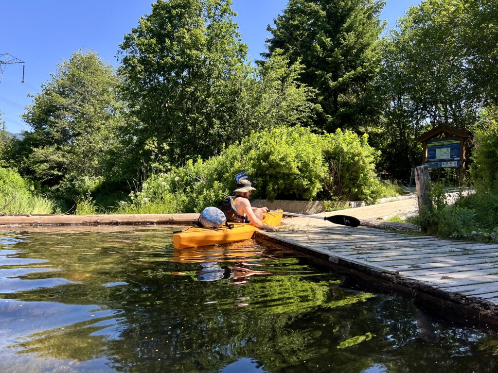 jake preparing to take his kayak out at the fish weir along the river of golden dreams