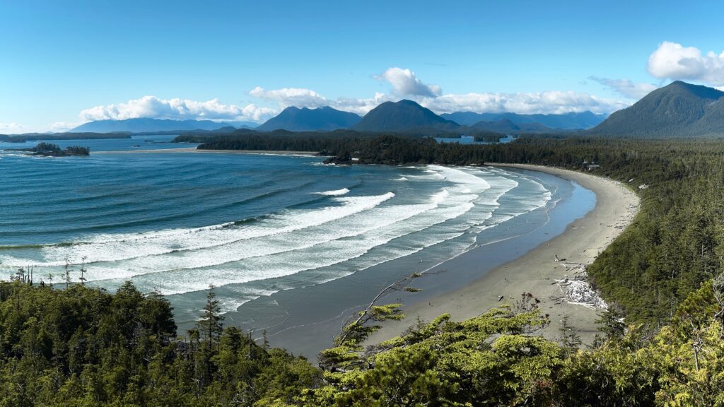 view of Cox Bay Beach from the Lookout hike of all the mountain peaks surrounding tofino