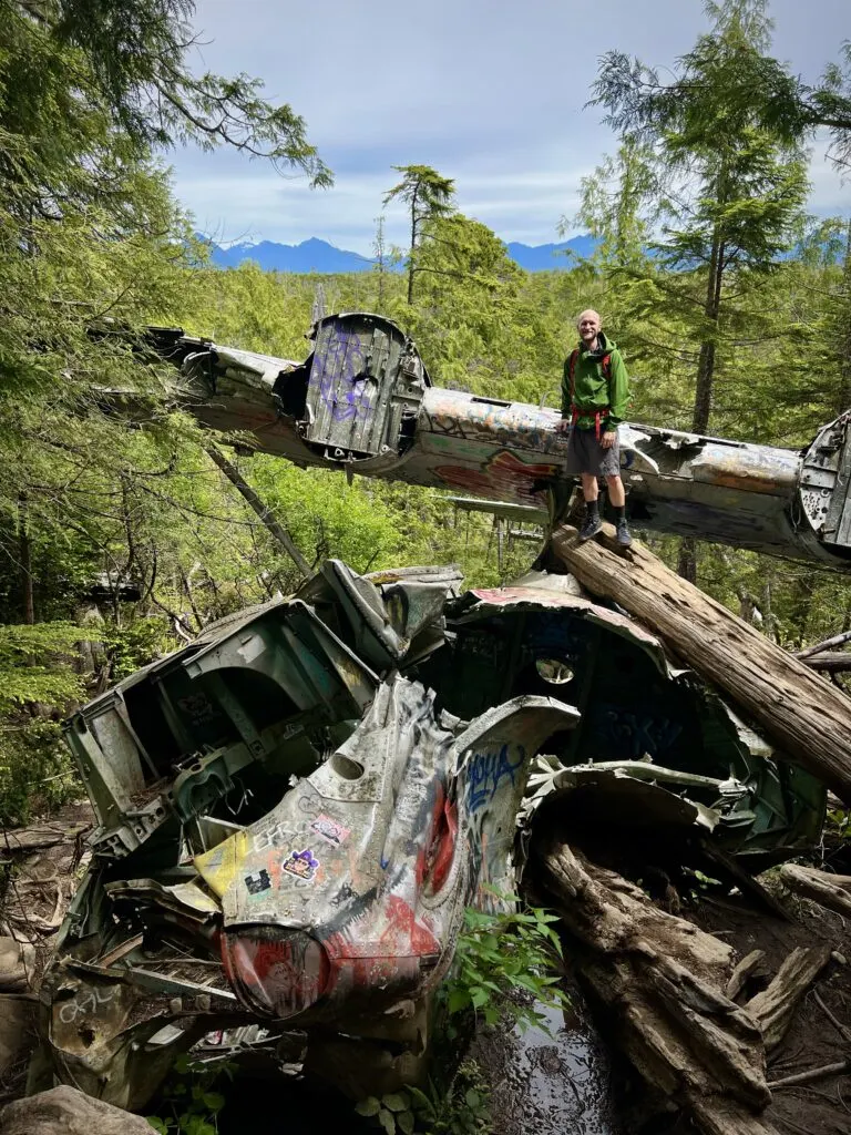 Jake standing on the wing of the plane from the Canso Plane Crash in Tofino