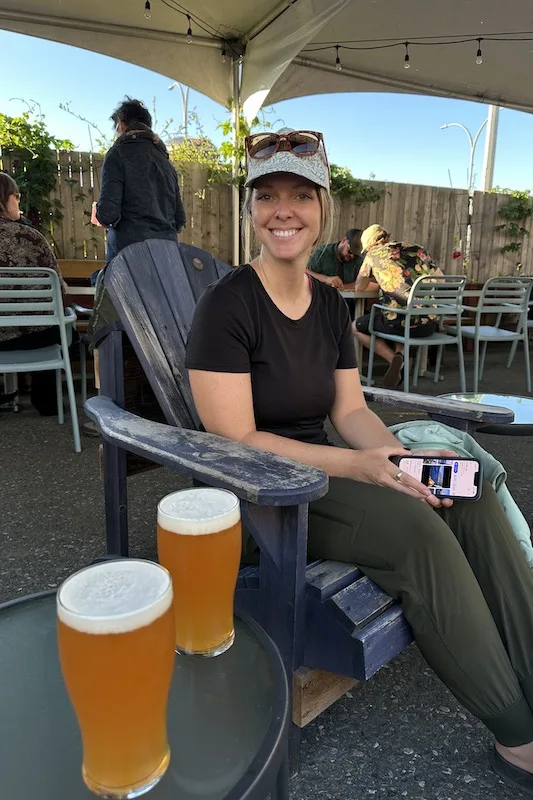 Emily enjoying a Hazy IPA at Beach Fire Brewing Company in Cambell River British Columbia.