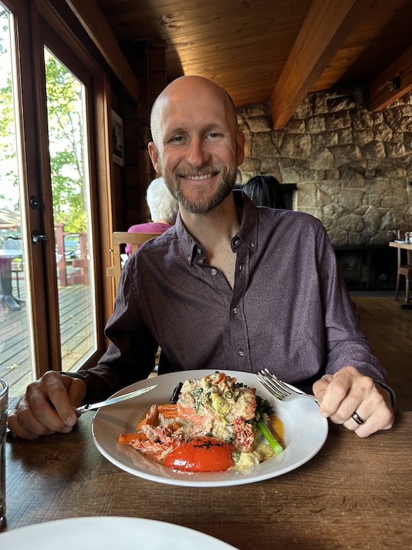 Jake enjoying his Salmon entree at Anglers Dining.