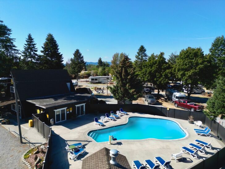 an aerial view of the Spokane KOA pool outside the main entrance with chairs lined up nicely around the pool